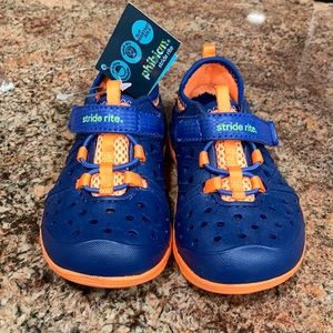 New with tags Stride Rite Phibian shoes. Navy Blue with bright orange accents.